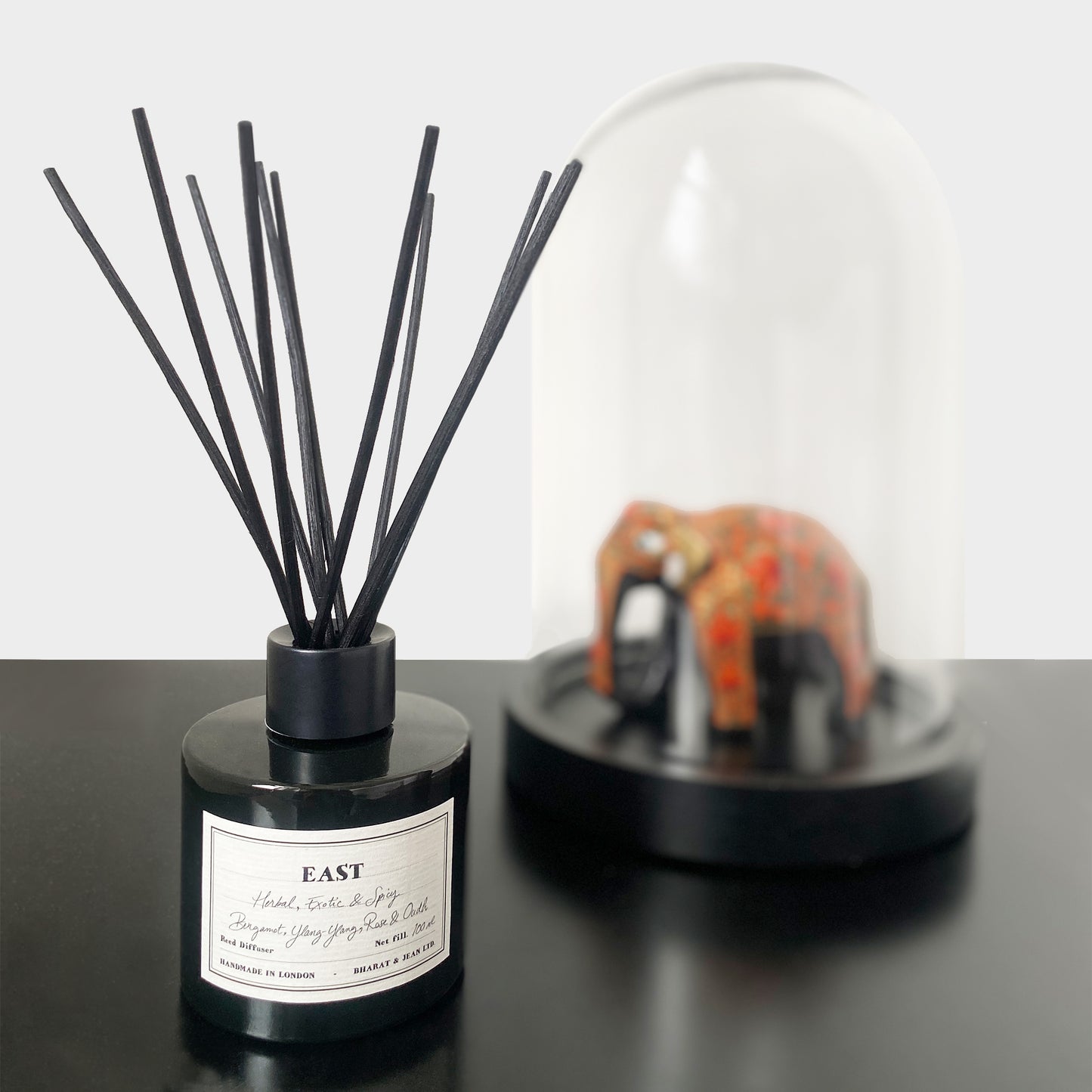 Bharat & Jean East Reed Diffuser in amber glass bottle