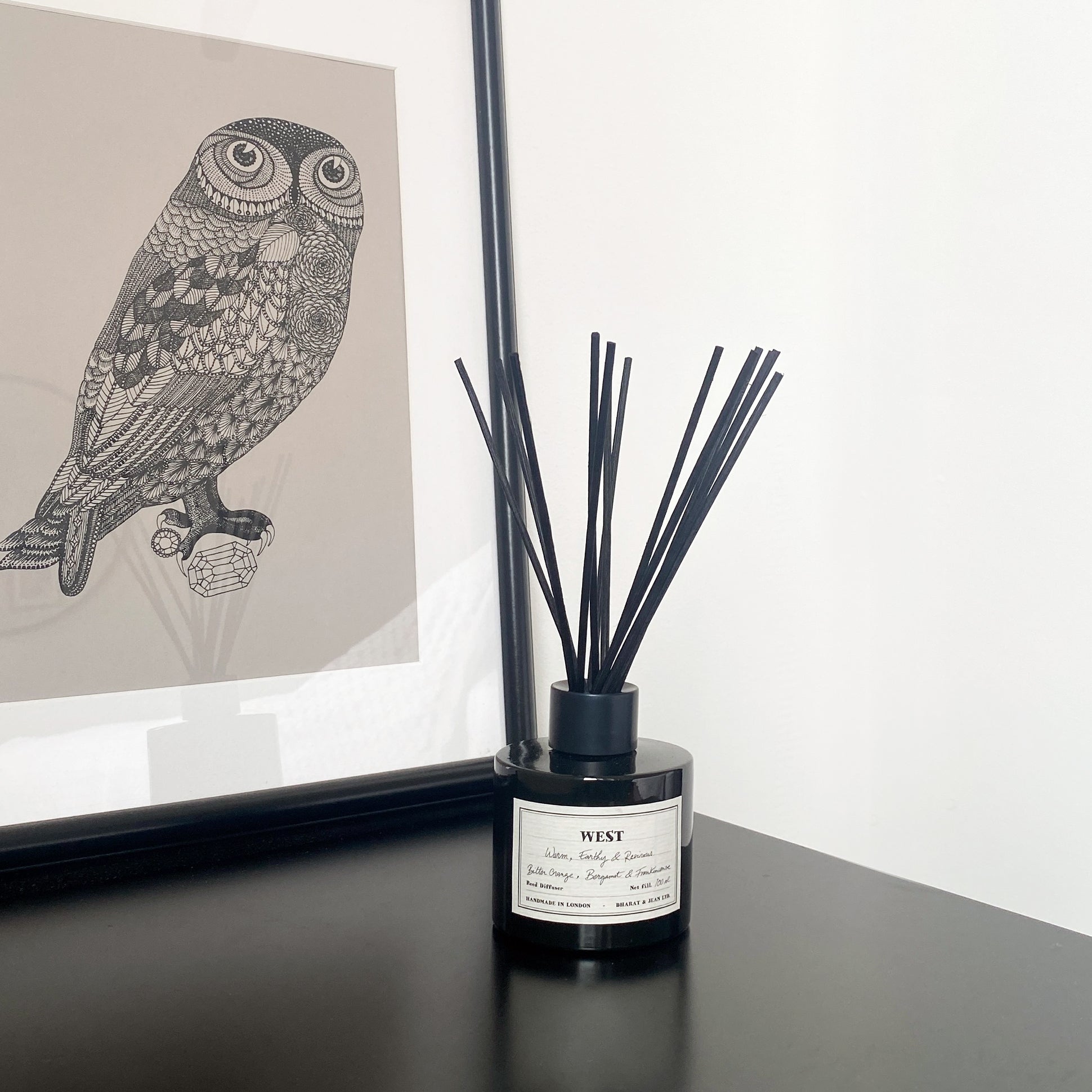 Earthy autumnal reed diffuser with black rattan reeds