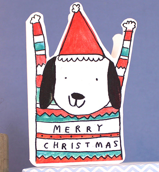 Playful cut-out Christmas card featuring a dog wearing a festive jumper, by Laura Skillbeck