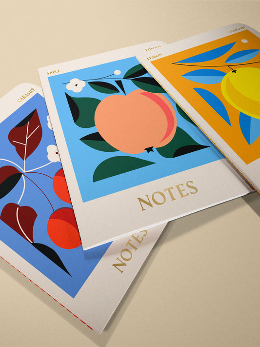 Set of 3 sustainable stitched notebooks with cherry, apple, and lemon designs, handmade in Brighton, UK