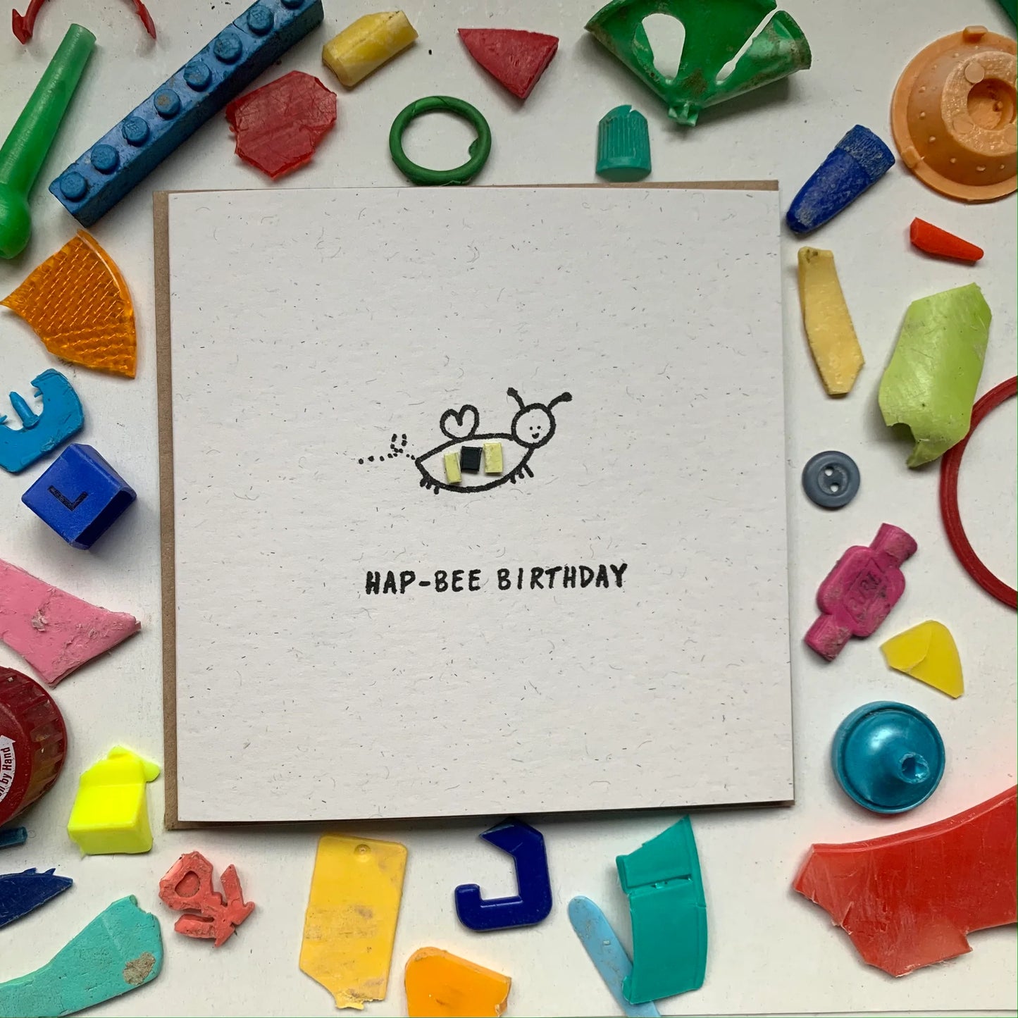 This handmade ‘Hap-Bee Birthday’ card is perfect for a special someone in your life! No two cards will ever be the same - so the card you get might ever so slightly vary from the picture. Featuring a buzzing bee pen drawing with micro plastic attached and the words Hap-Bee Birthday.