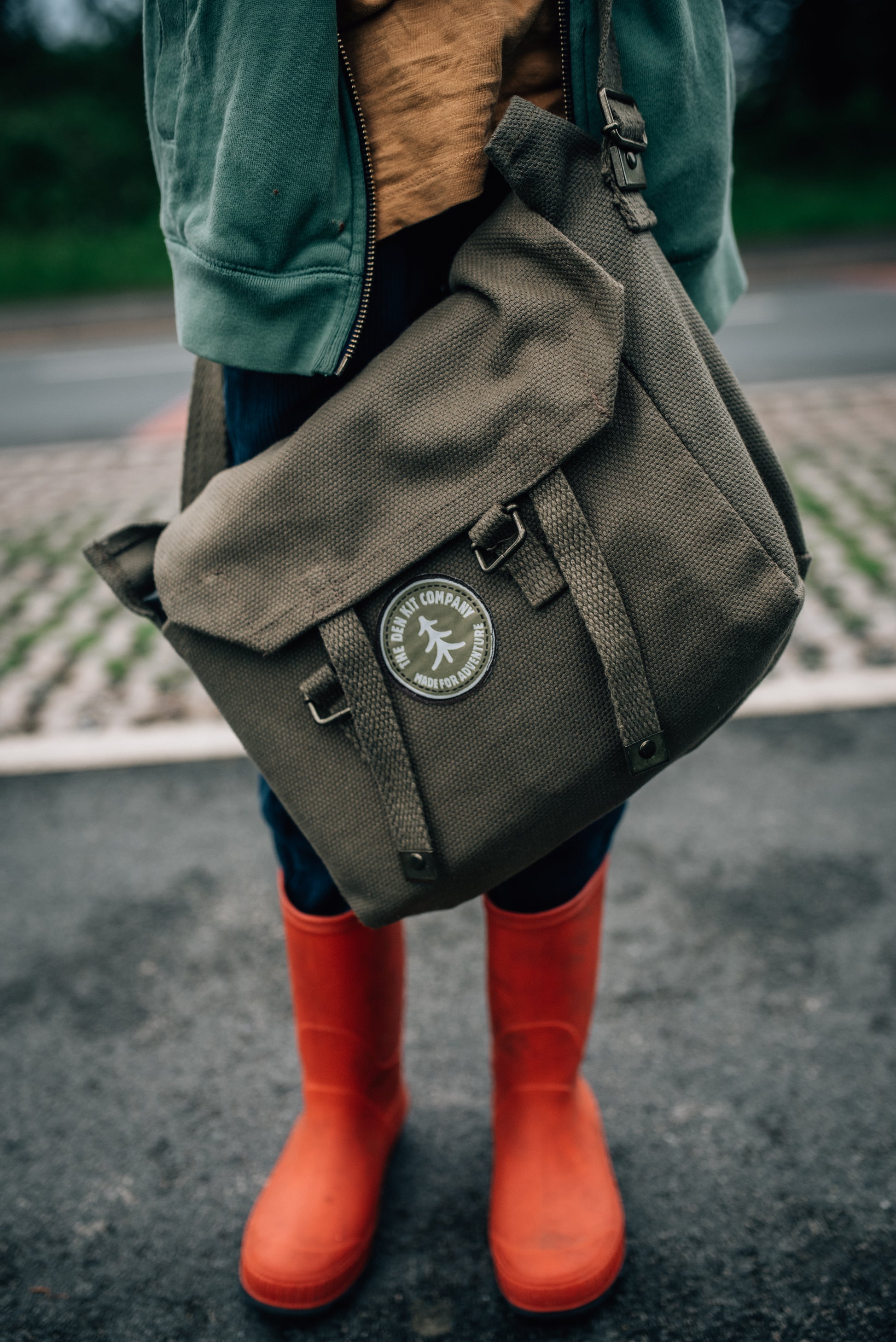 A child in their wellington boots, and the Dent Kit bag .