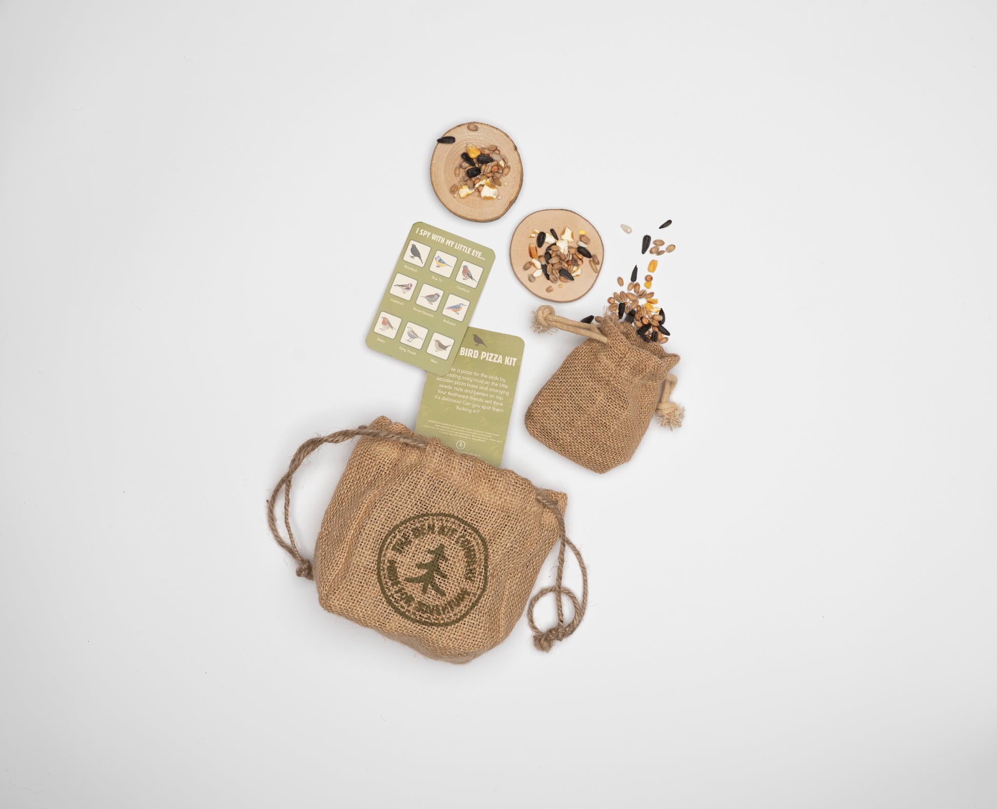 Mini Make a Pizza for the Birds Kit with wooden disk pizza bases, mini sack of mixed bird seed, and illustrated British garden bird spotter card.