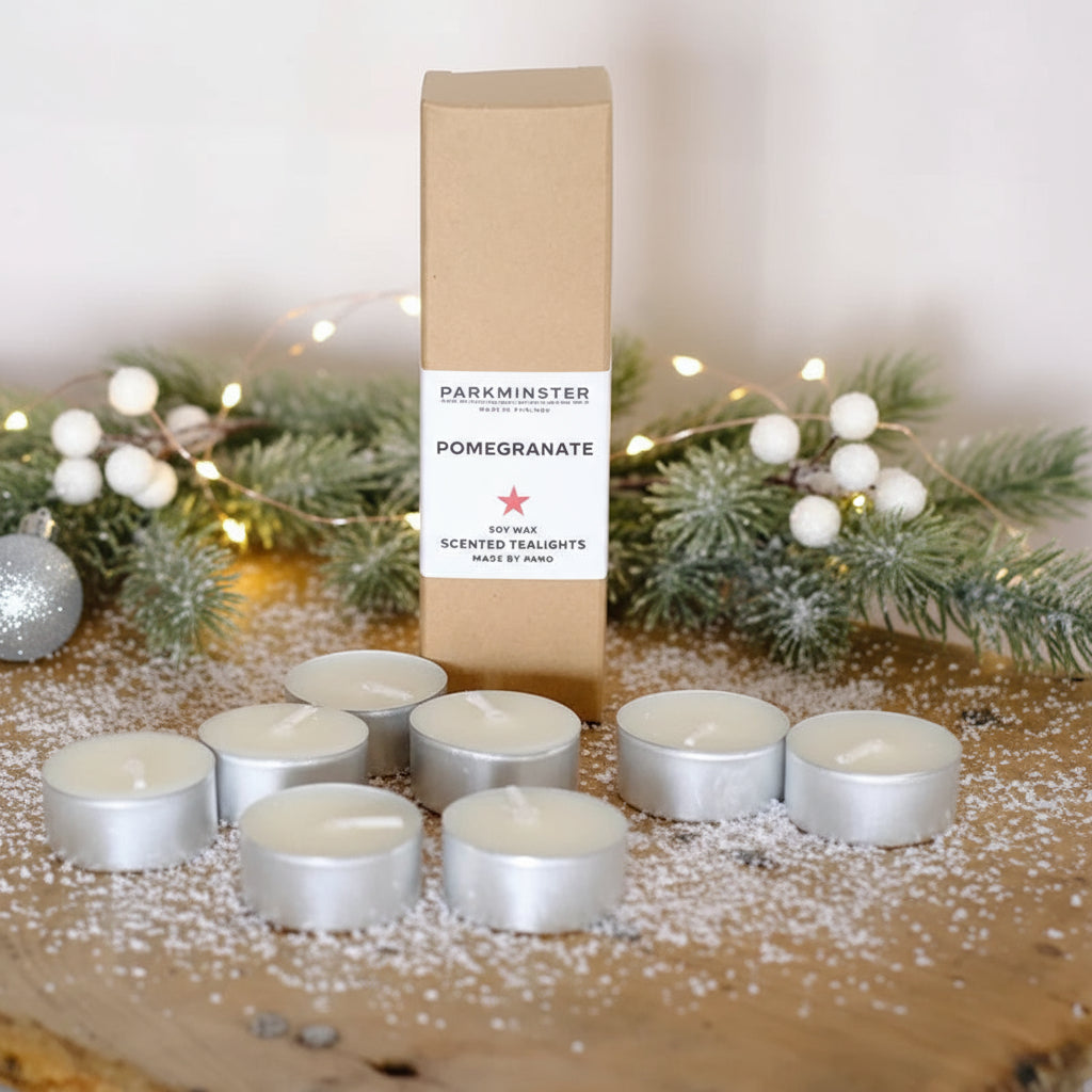 Eight Pomegranate scented soy wax tealight candles in recyclable aluminium cups, handmade by Parkminster in Cornwall. Vegan and plastic-free home fragrance.