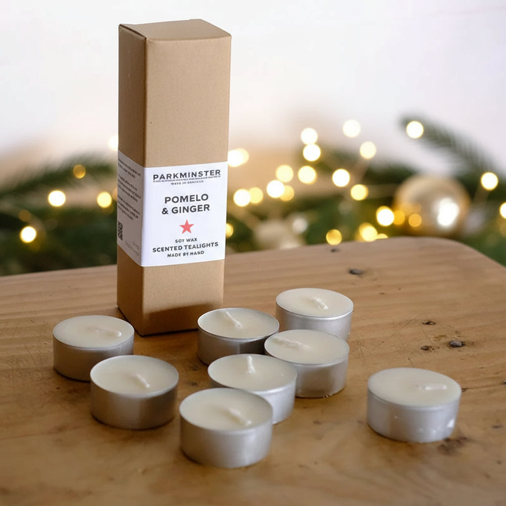 Close-up of Pomelo & Ginger soy wax tealights in recyclable aluminium cups, handmade in Cornwall
