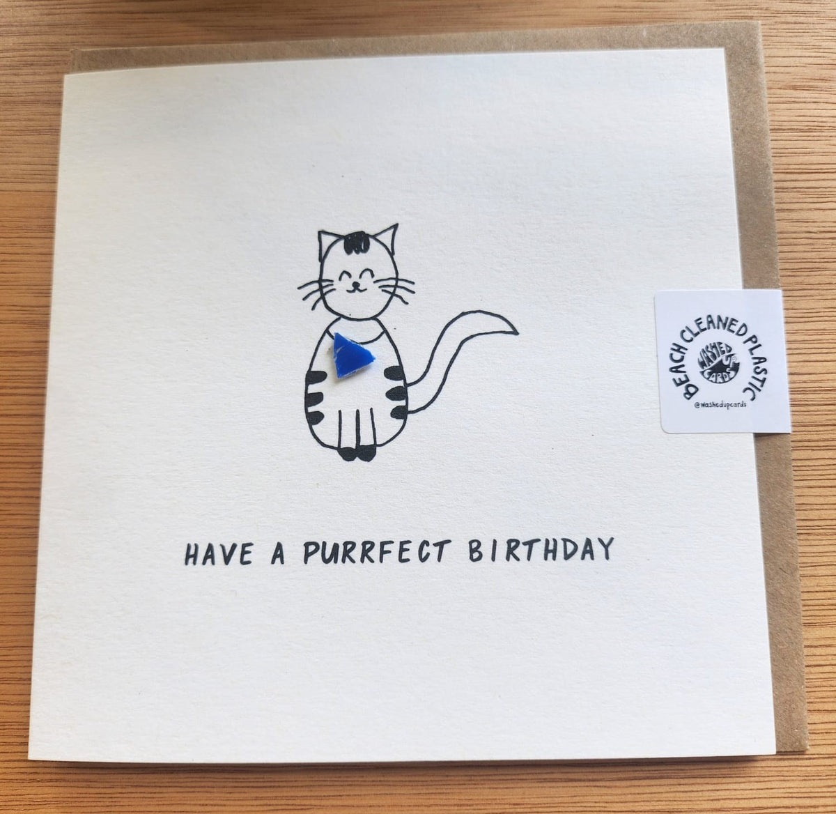 Unique 'Purrfect Birthday' card with microplastic art, front view