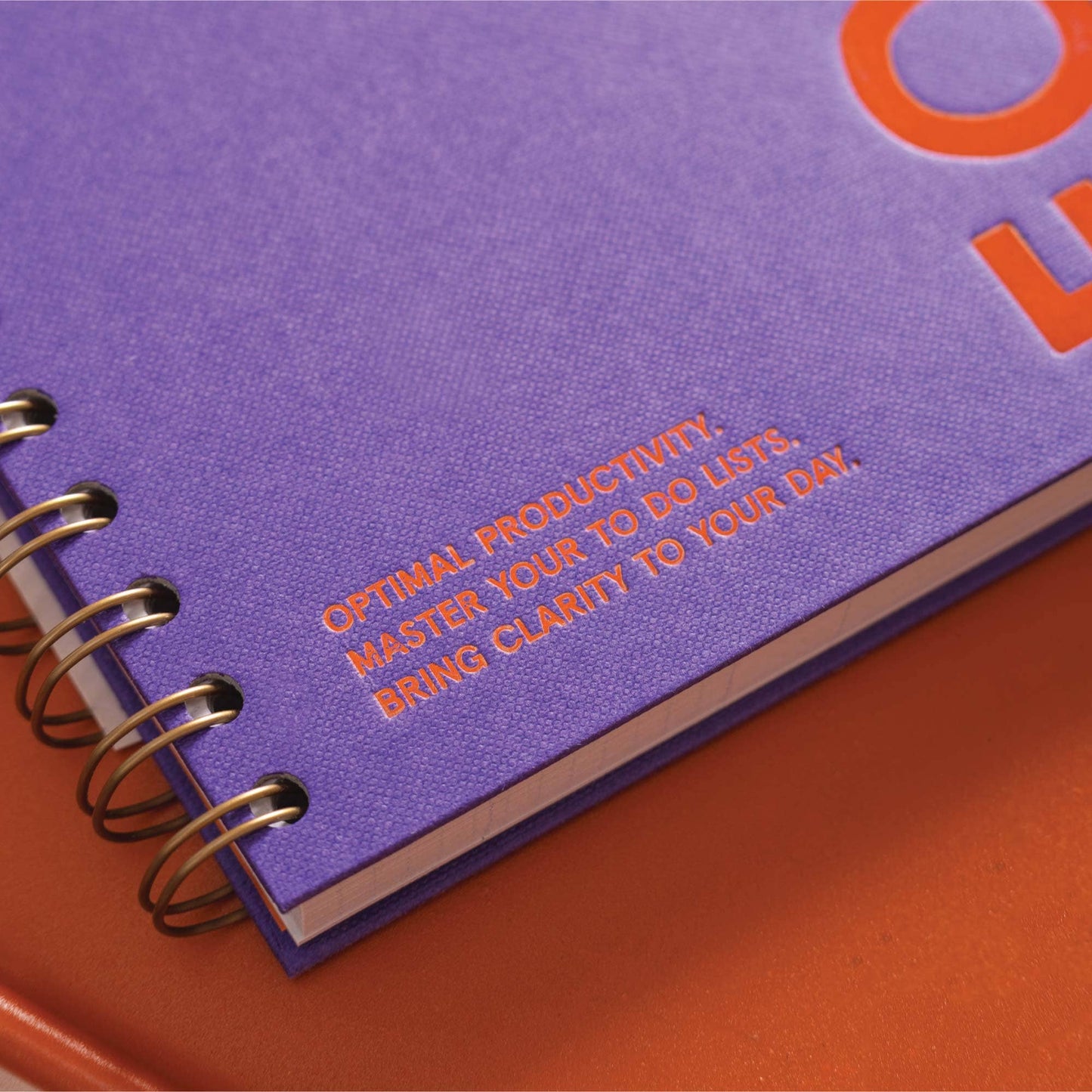 A5 hardback purple productivity planner open showing daily layout