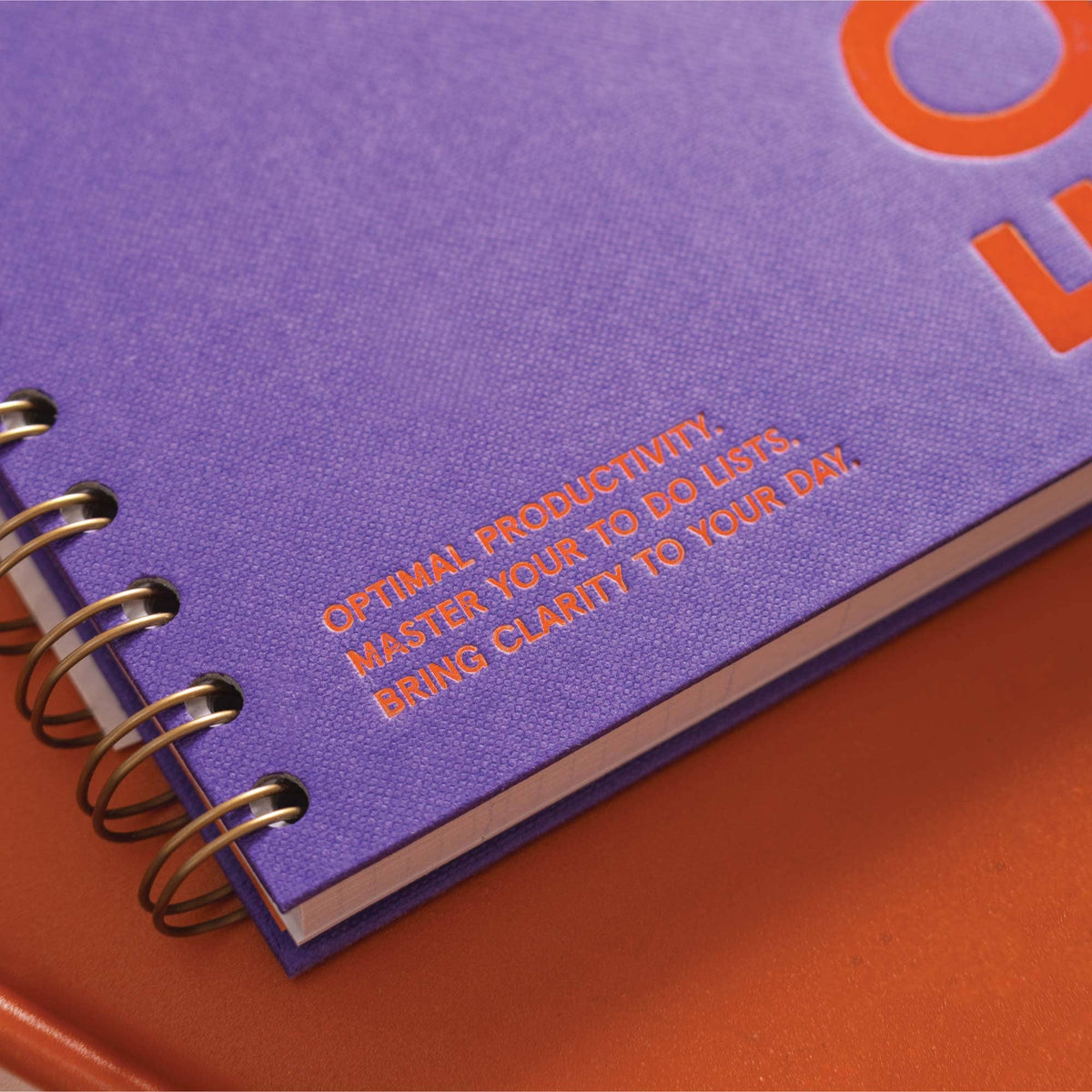 A5 hardback purple productivity planner open showing daily layout