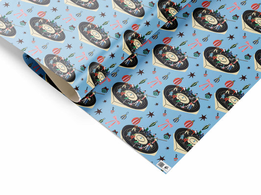 Jingle Bell Rock Christmas gift wrap sheet with festive illustration printed on uncoated recyclable paper.