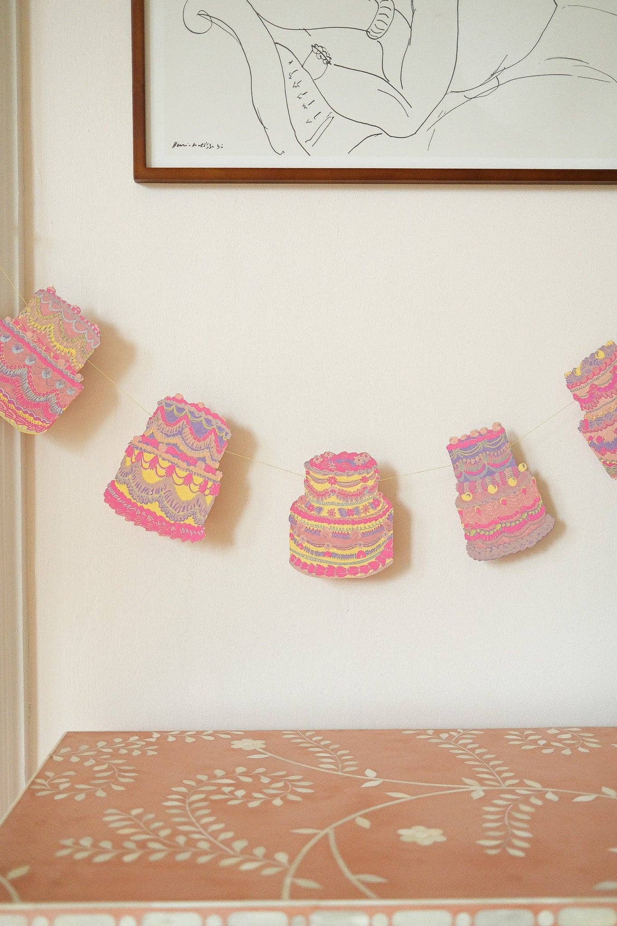 Artisan made celebration cakes party bunting in room