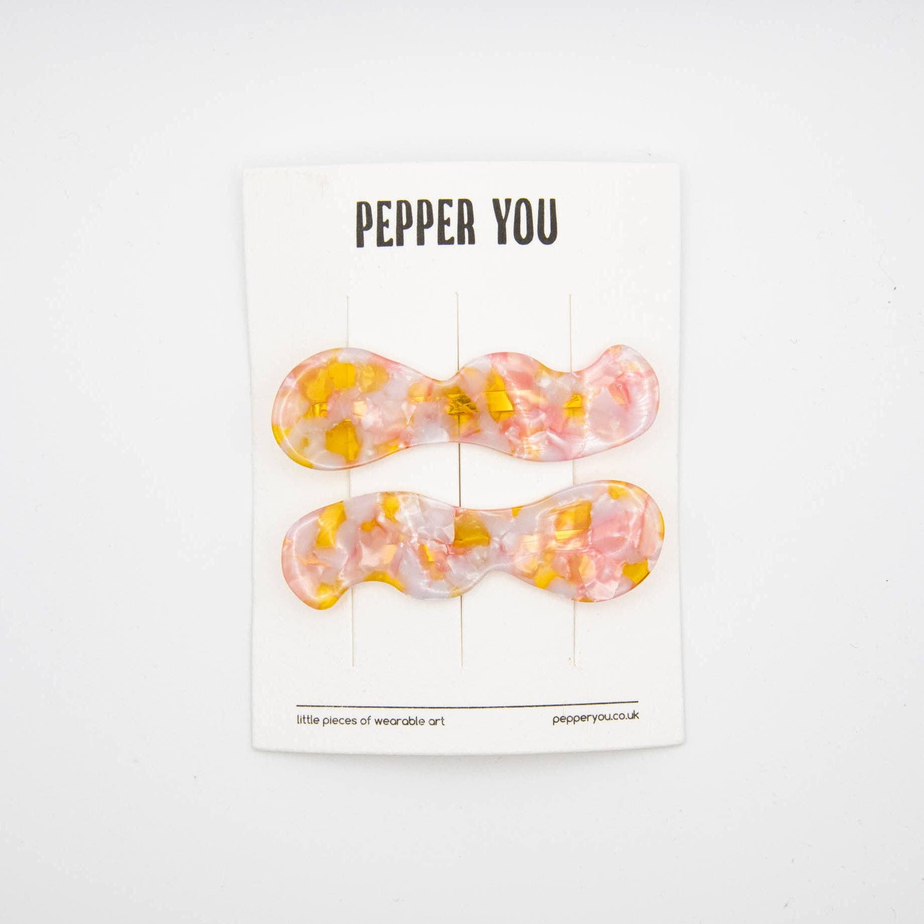 Set of two hair slides on card