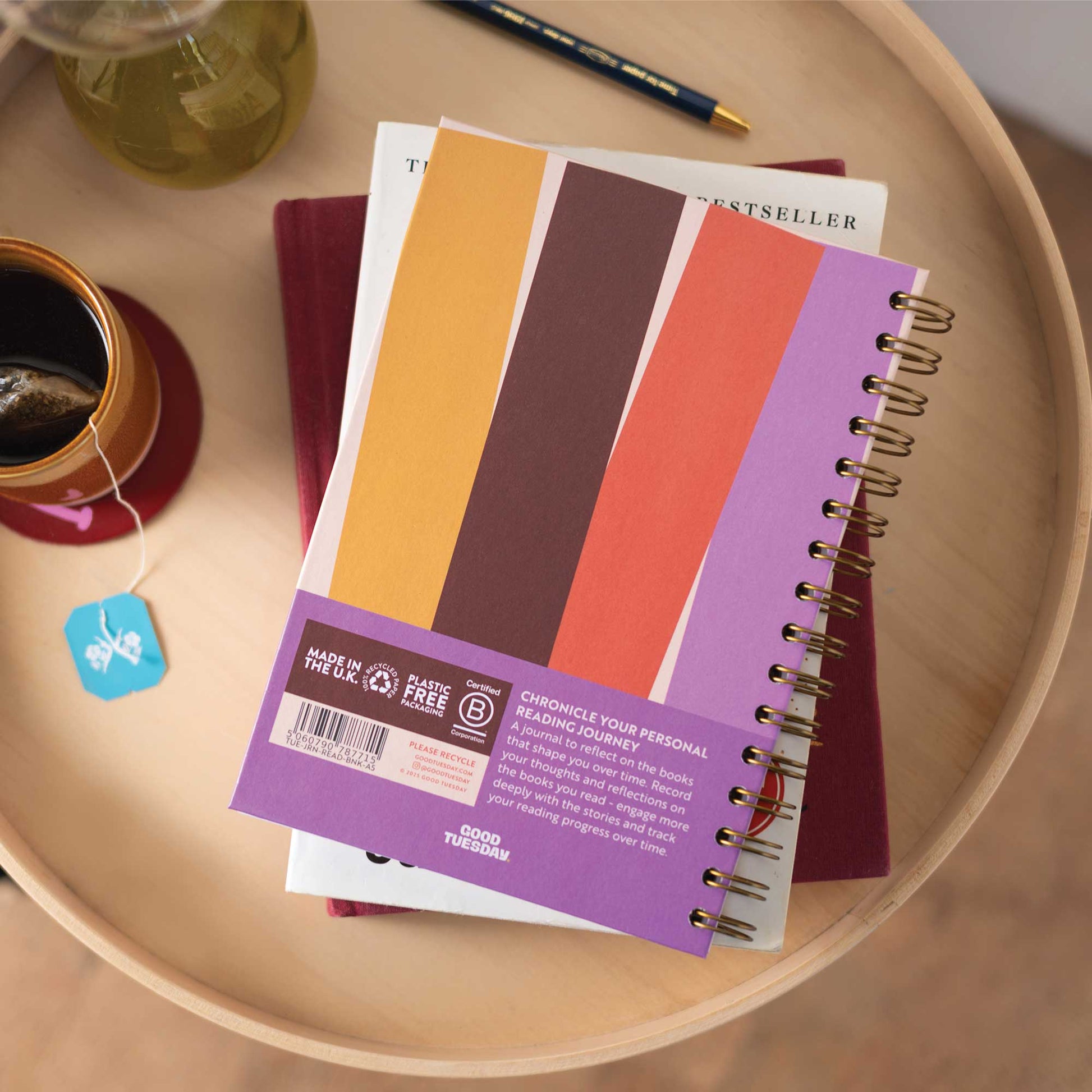 A5 Book Nook Reading Journal next to a cup of coffee, perfect for cosy reading