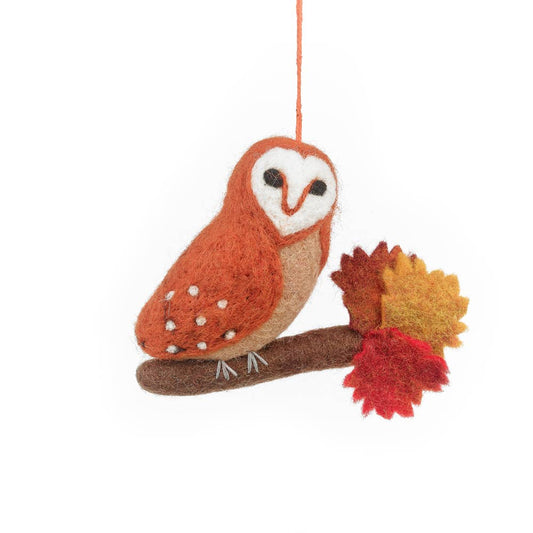 Felt owl ornament with autumn leaves . Handmade felt barn owl hanging decoration with burnt orange body, crafted for autumn, sustainable and fair trade artisan product