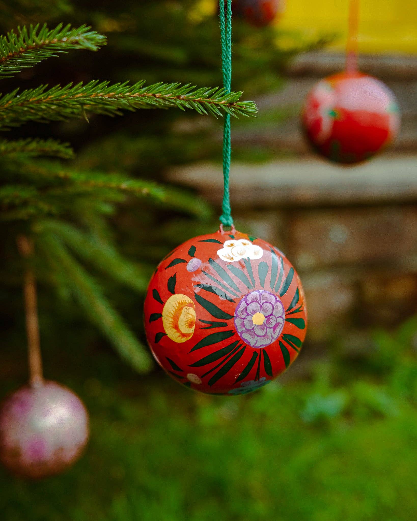 Hand-painted Red Bouquet Bauble by East End Press made from recycled papier mâché with velvet hanging loop