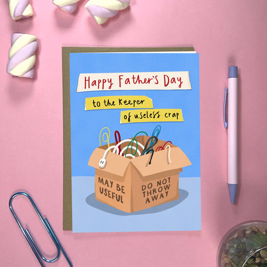 Close-up of the humorous 'Keeper of Cables' Father's Day card, showcasing the playful design on textured card stock.