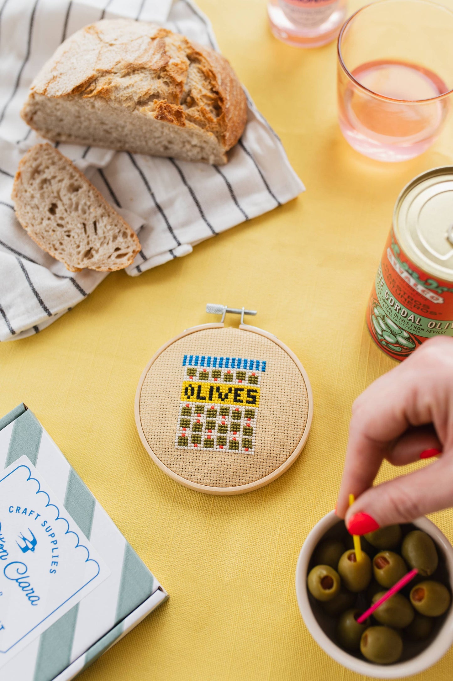Eco-friendly, fully recyclable packaging for the Olives Mini Cross Stitch Kit, proudly designed and made in the UK.