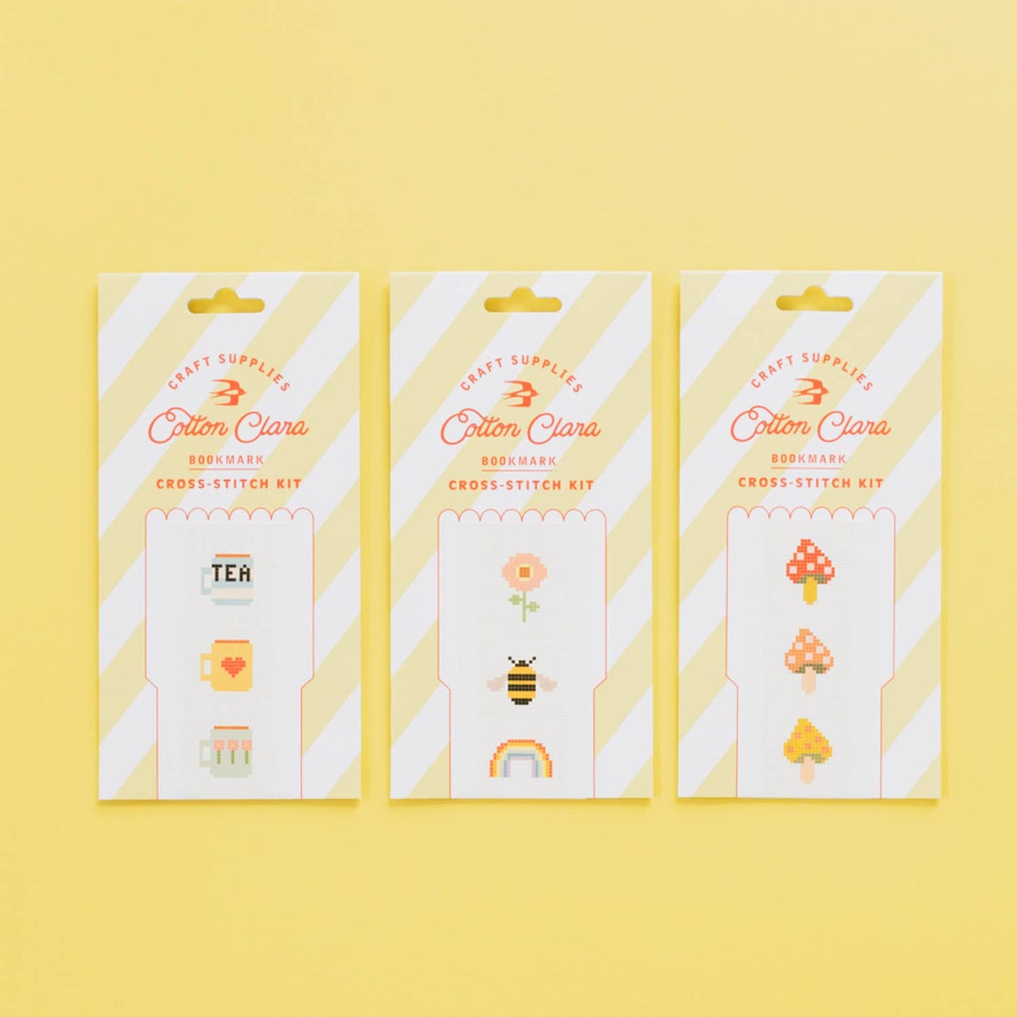 Close-up of unprinted white Aida fabric and colourful embroidery threads