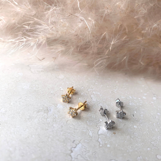 Pair of Little Nell mini star stud earrings, sterling silver, close-up