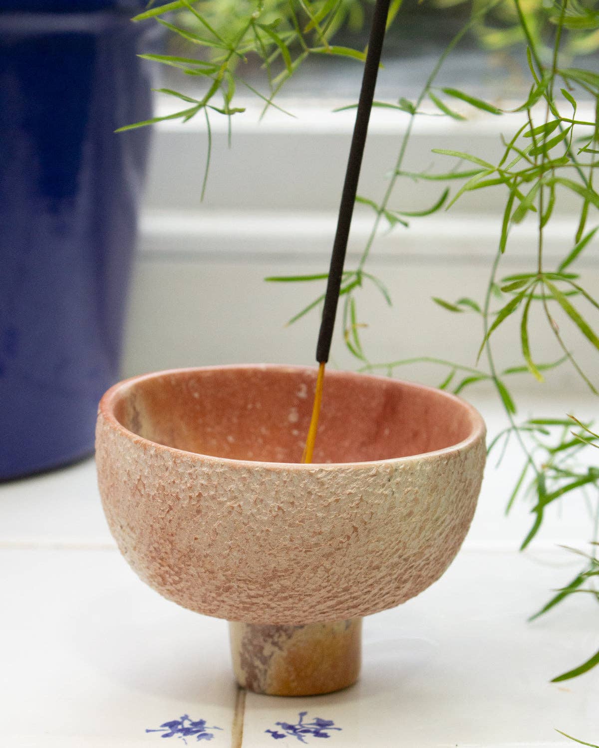 Close up of hand-carved pink soapstone incense bowl from Kenya