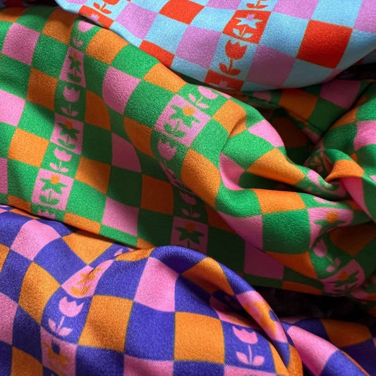 Close up of recycled plastic satin fabric on Caissa scrunchie