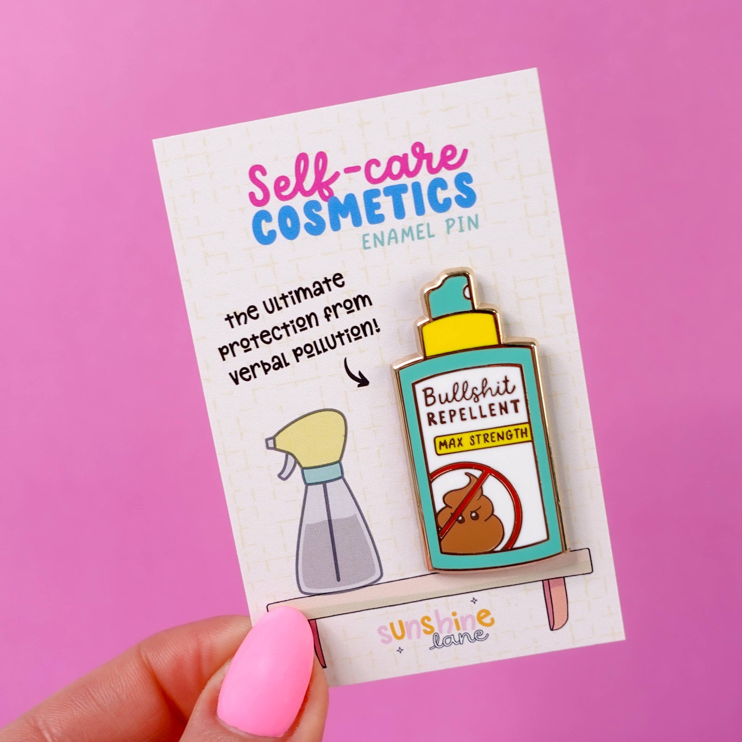 Bullshit Repellent Gold Enamel Pin shaped like a spray bottle