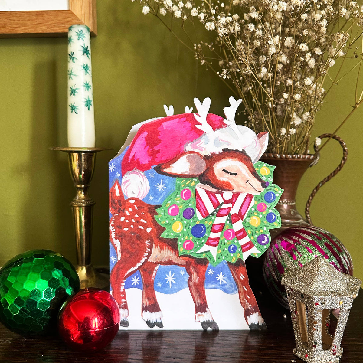 Eco-friendly vintage style Christmas card featuring whimsical reindeer design