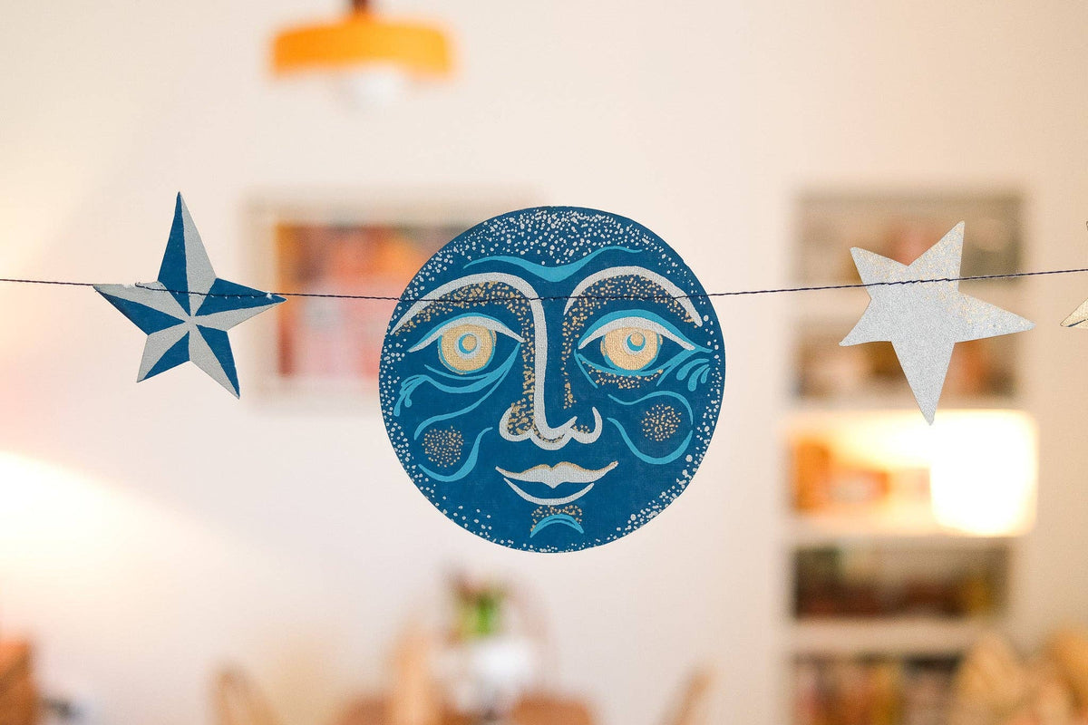 Handcrafted celestial paper garland packaging