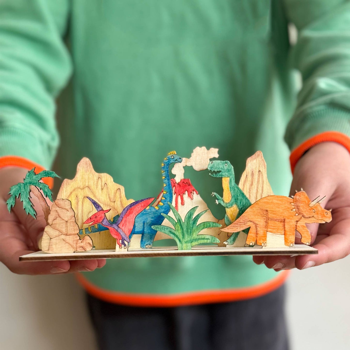 This craft kit is perfect for those who love to be creative, those who love dinosaurs (who doesn't!). Inside, discover a collection of wooden pieces, each intricately designed to spark creativity, including the mighty T-Rex, a triceratops, pterodactyl and a brachiosaurus. With wooden parts of all your favourite dinosaurs, plus scenery, the watercolour pencils &amp; paintbrush included allow for detailed ; precise painting with the ability to mix colours. Once painted, simply add the wooden parts 