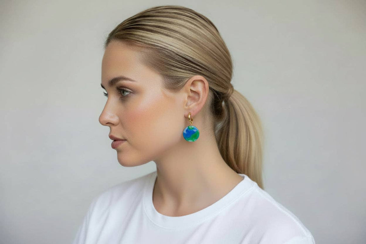 Park Life round clay earrings showing gold hoop-style studs