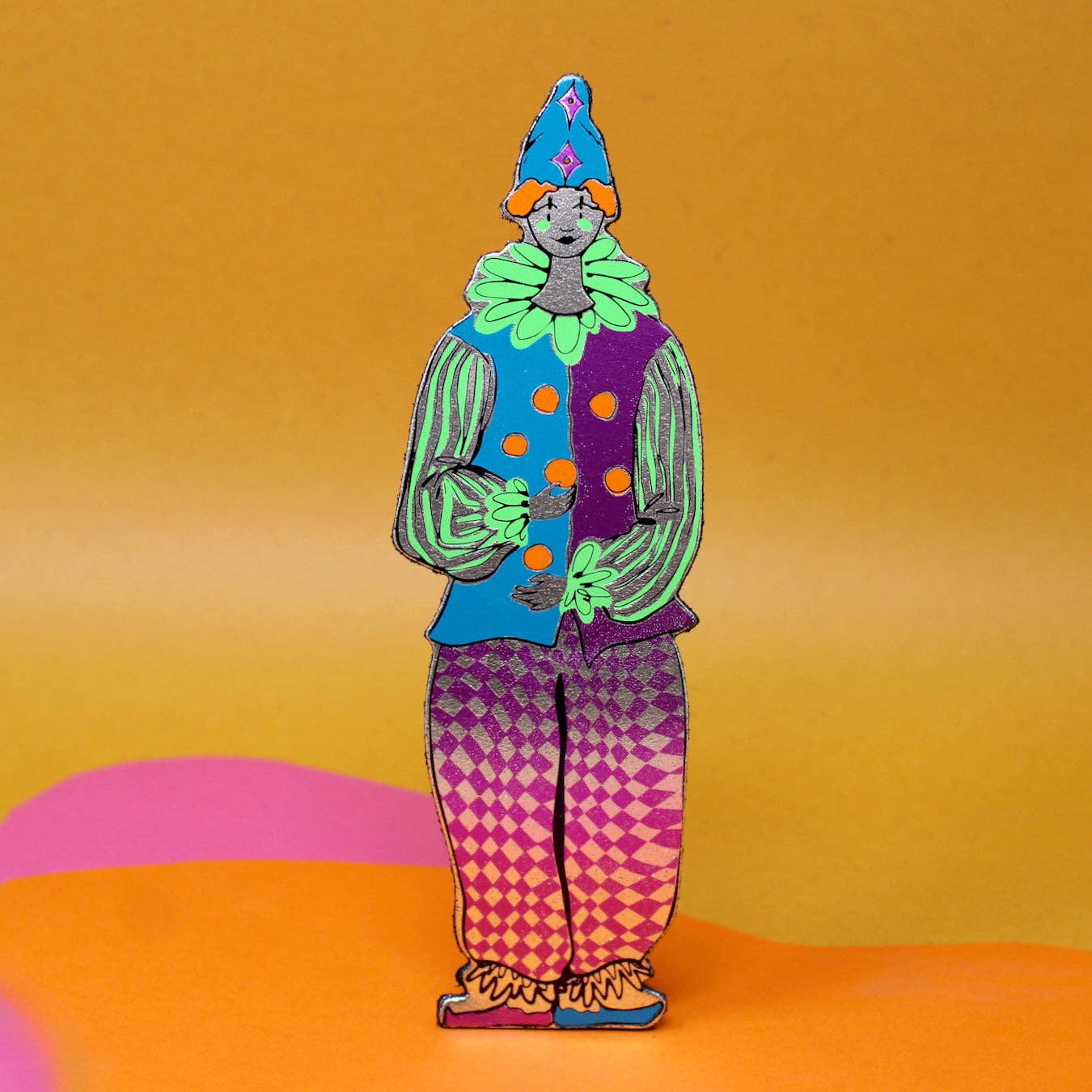Close-up of the shiny and matte foil details on the leather clown bookmark