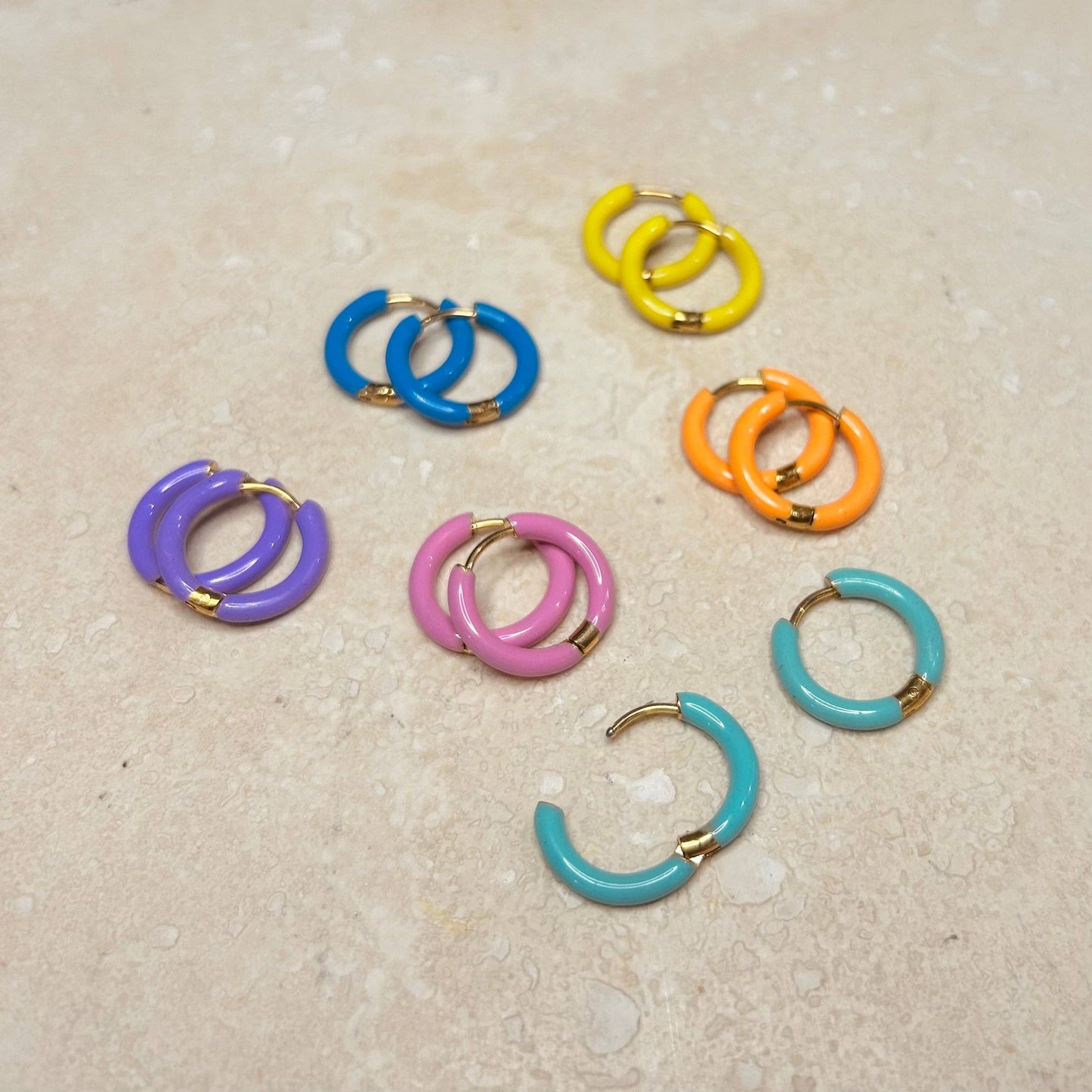 Candy Enamel Hoops, with gold plated fixings. 6 colours available, blue, green, yellow, orange, pink, lilac. 17mm wide with comfortable hinge click fastening 