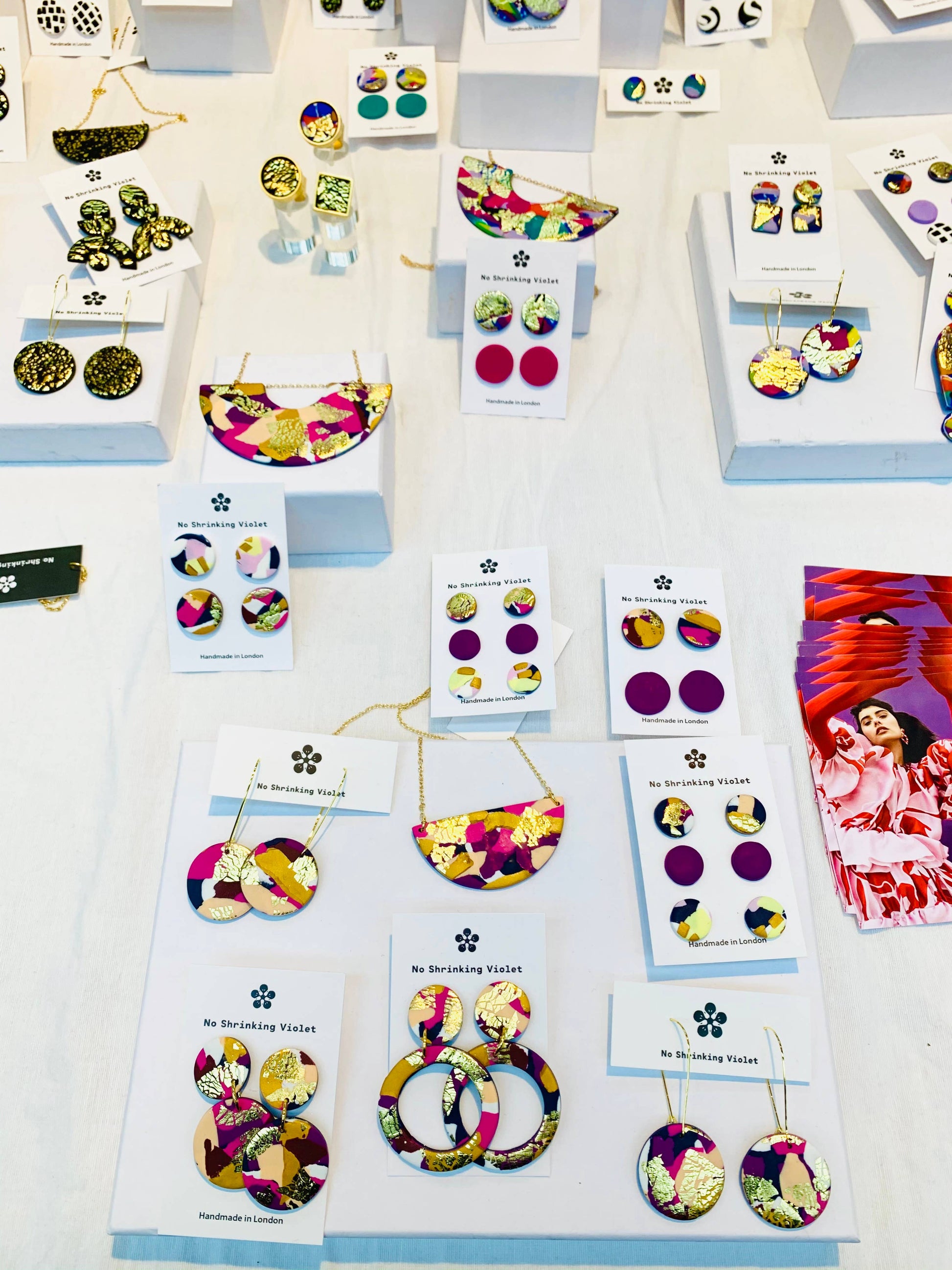 Full set of Winter Sunrise, Violet, and Summer Nights polymer clay stud earrings.