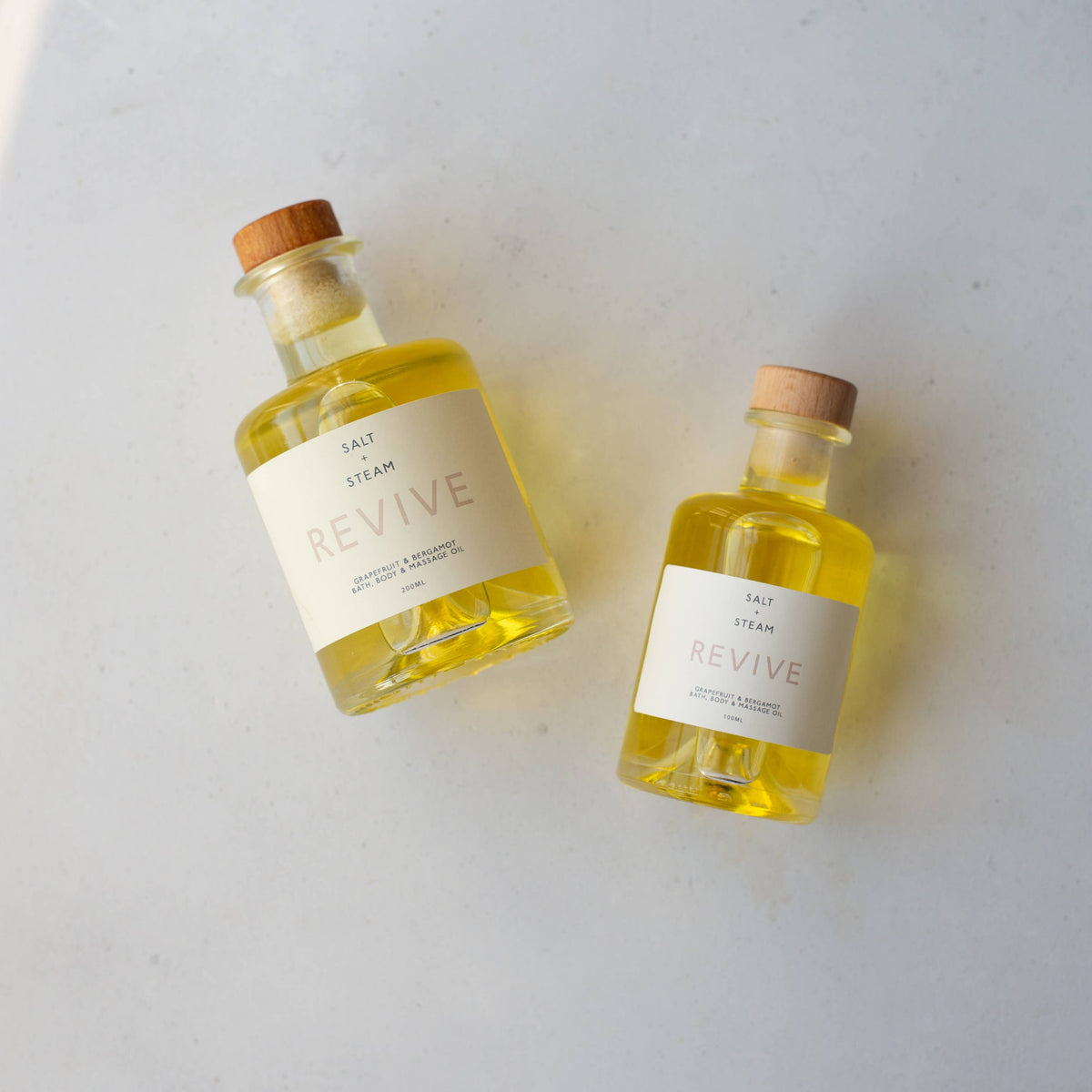 Eco-friendly vegan bath oil pouring into water to create milk