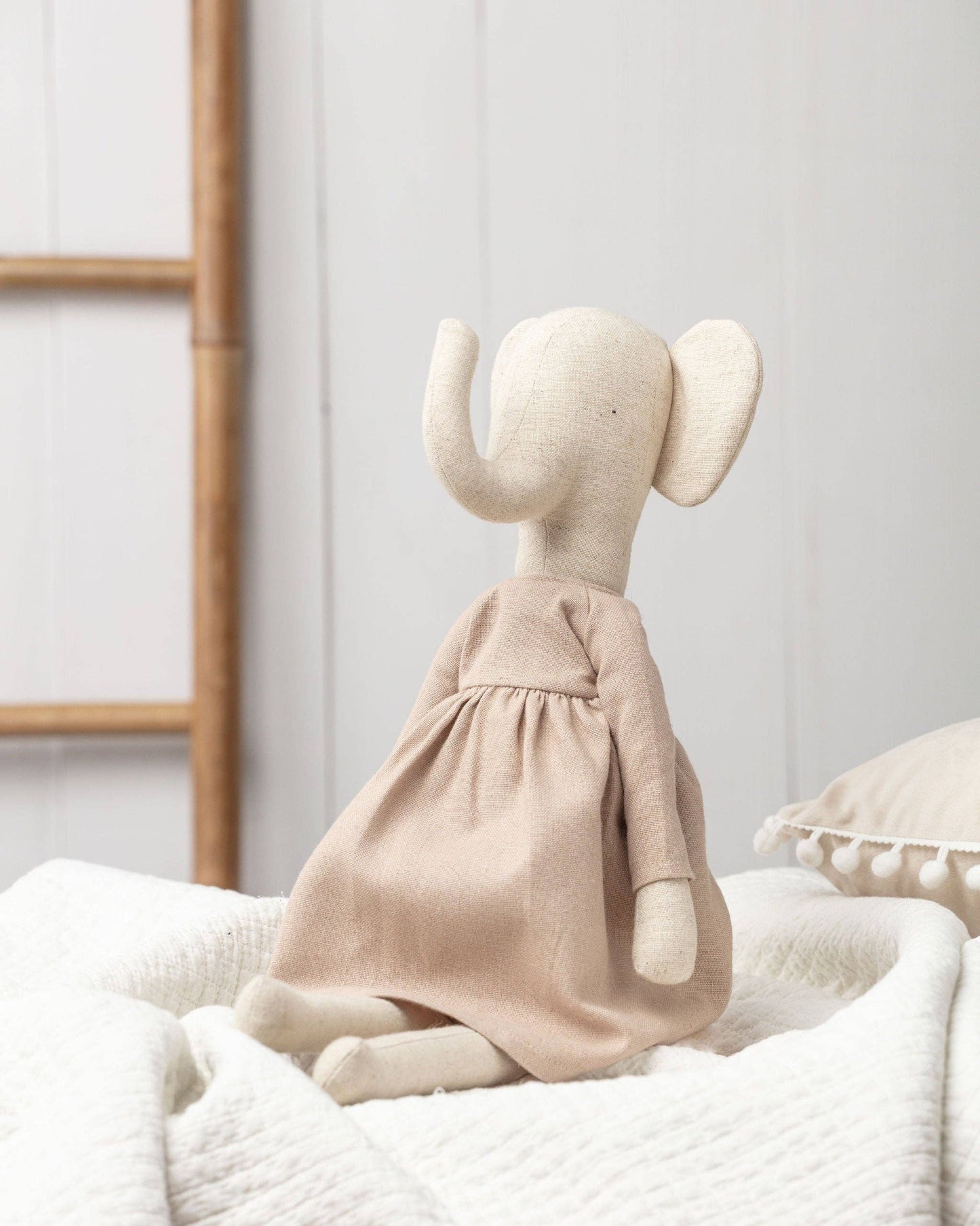 Elsie the Elephant is an adorable soft toy. Ideal for imaginative play at home or as a delightful companion on exciting outings, Elsie is perfectly sized for bedtime snuggles and fits neatly into any bag for travel fun.

Each Adventure Pickle, including Elsie, comes with its own adventure backpack, perfect for gathering treasures and creating wonderful childhood memories.
Dressed in simple, natural, earthy-toned dress.