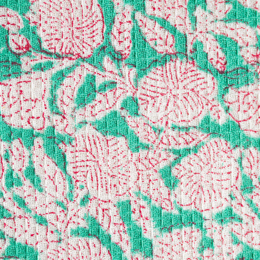Close up of blue and olive botanical block print on waffle cotton