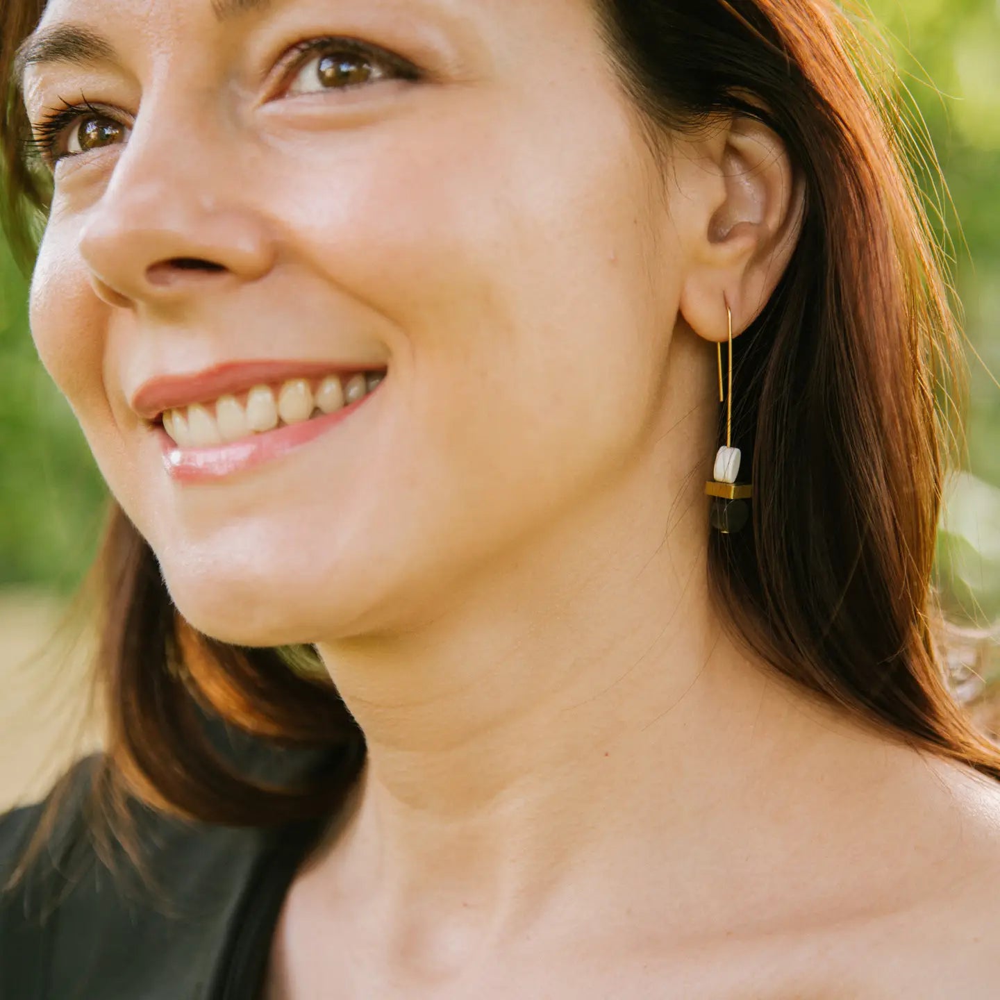 Elegant monochrome and gold double bead earrings by Copper Bee with black and white ceramic beads and solid brass cuboid on gold-plated wires, handmade in the UK.