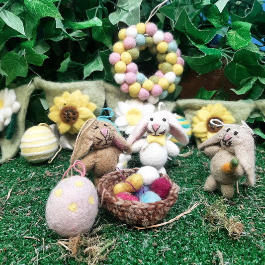 Close-up of three eco-friendly felt Easter bunnies, plastic-free and ethically made by Nepalese artisans.