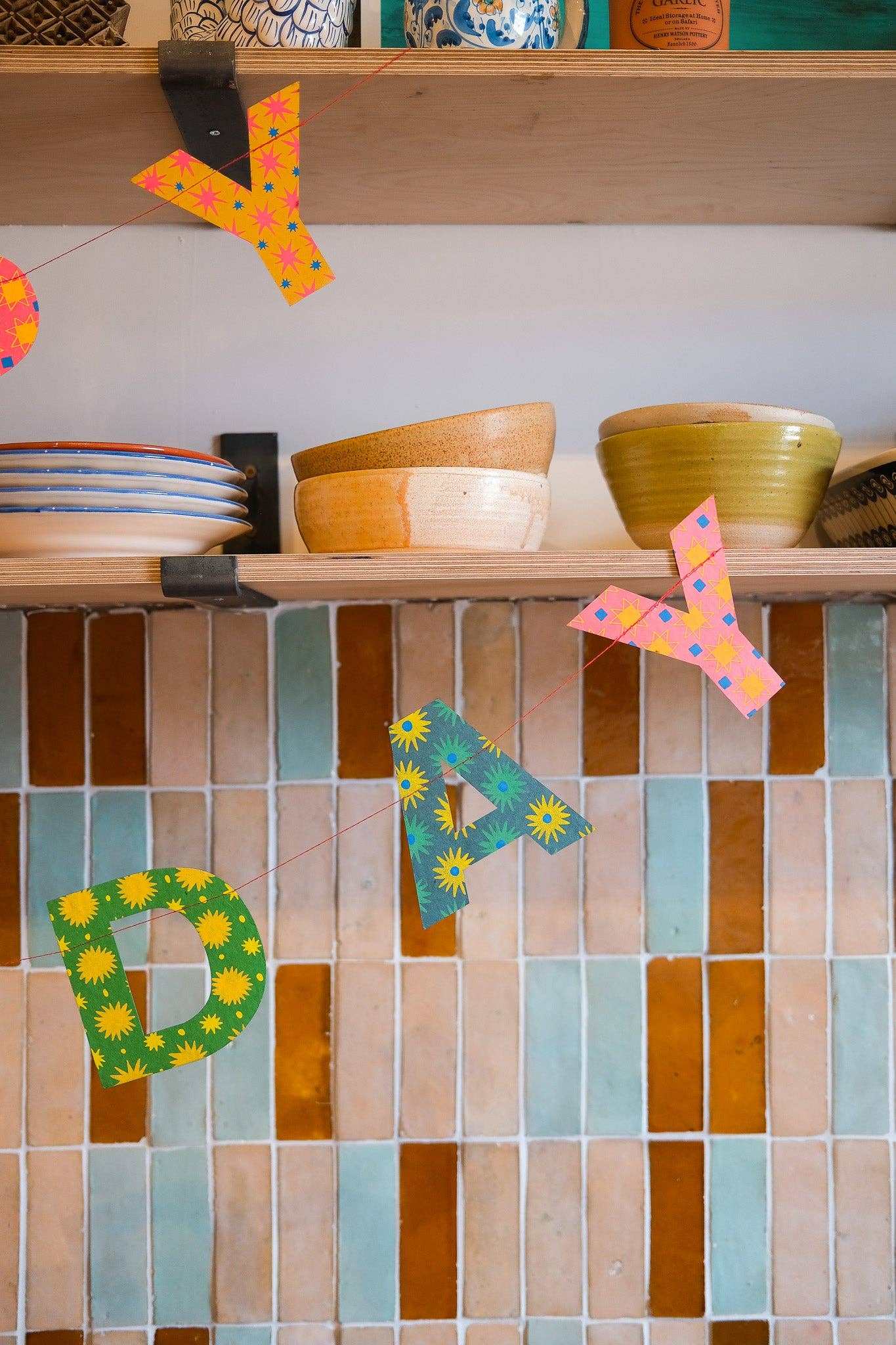 Brightly coloured sewn garland for birthday parties
