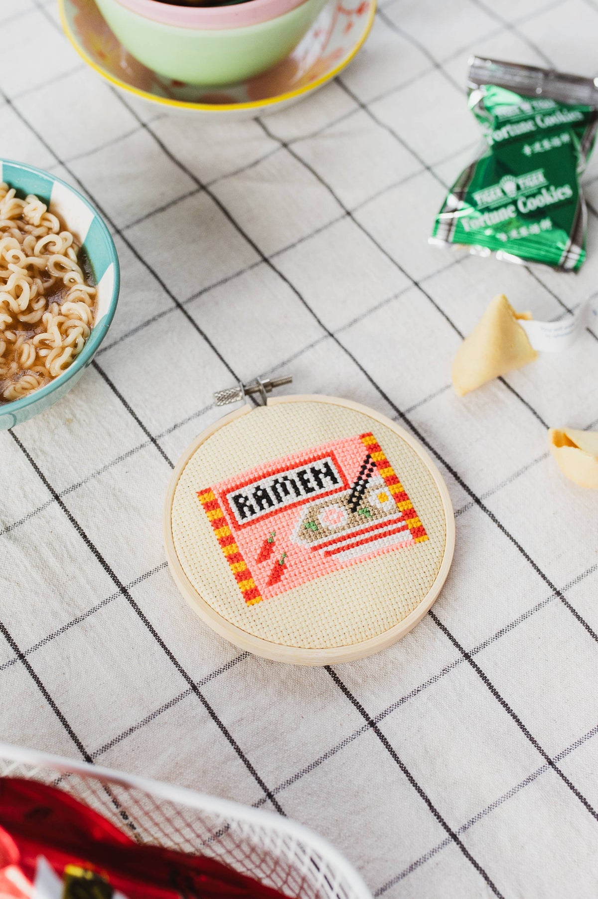 Close up of the neon pink and yellow ramen embroidery details