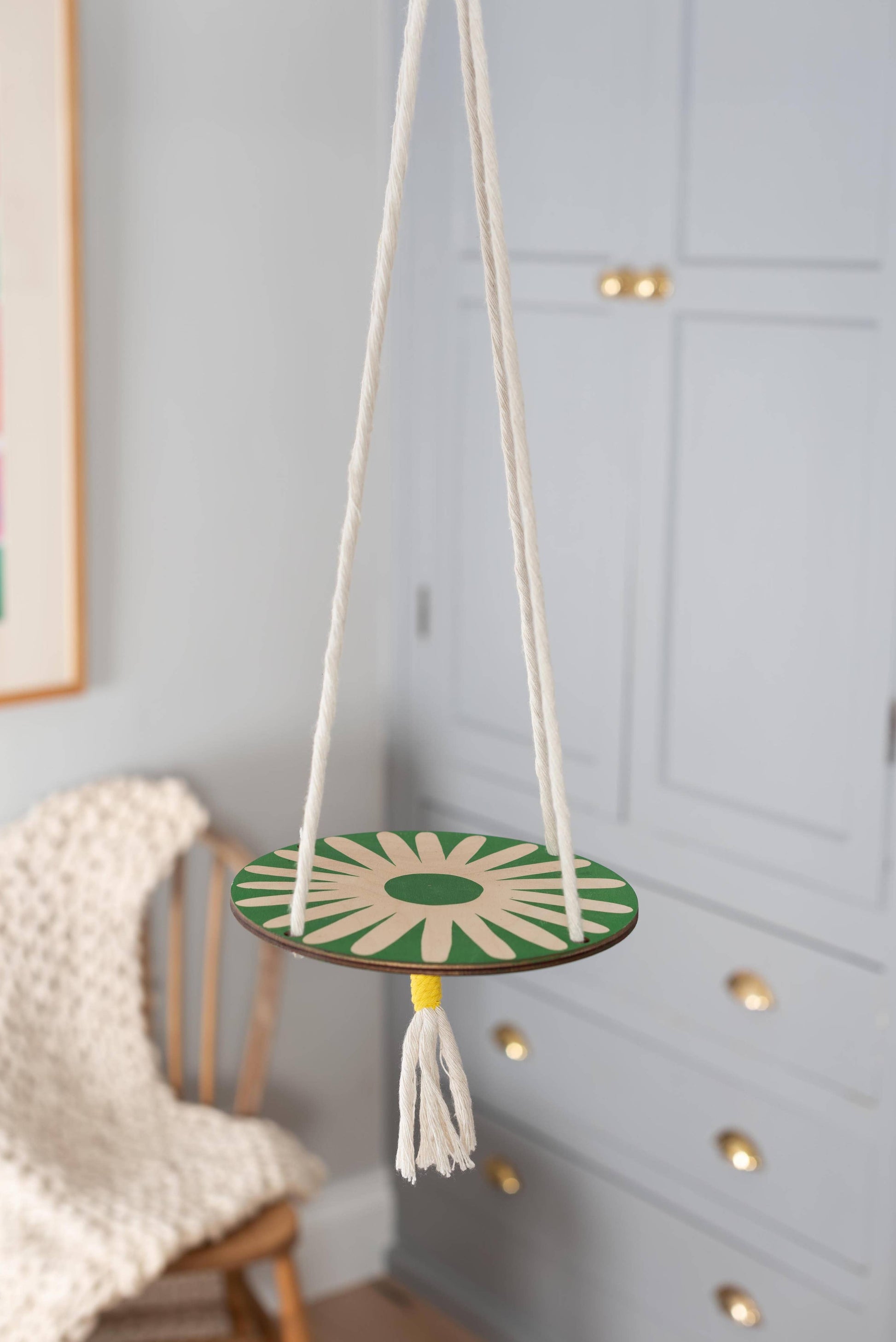Green daisy design on sustainably sourced birch plywood disk