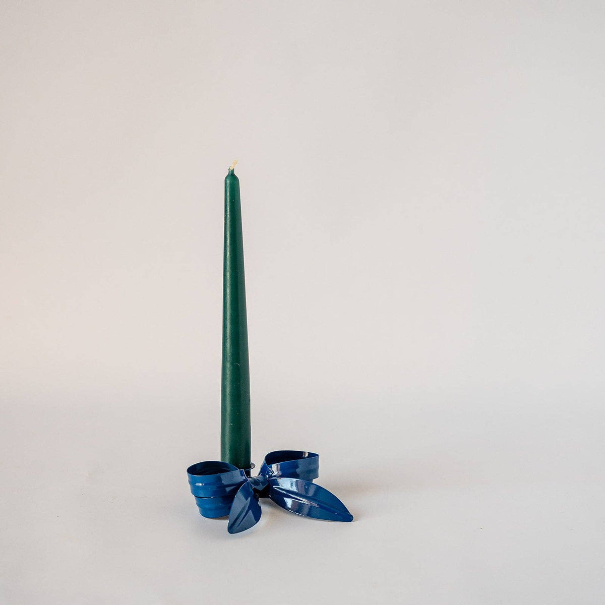 Gold Ribbon Bow Candlestick Holder with a dinner candle