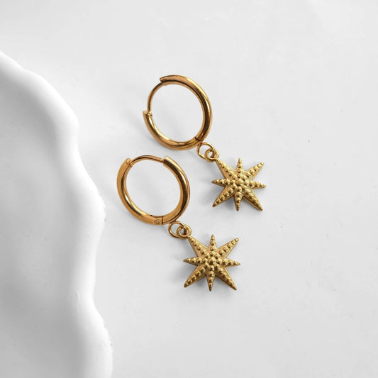 Zorya Star gold stainless steel hoop earrings with textured star charm