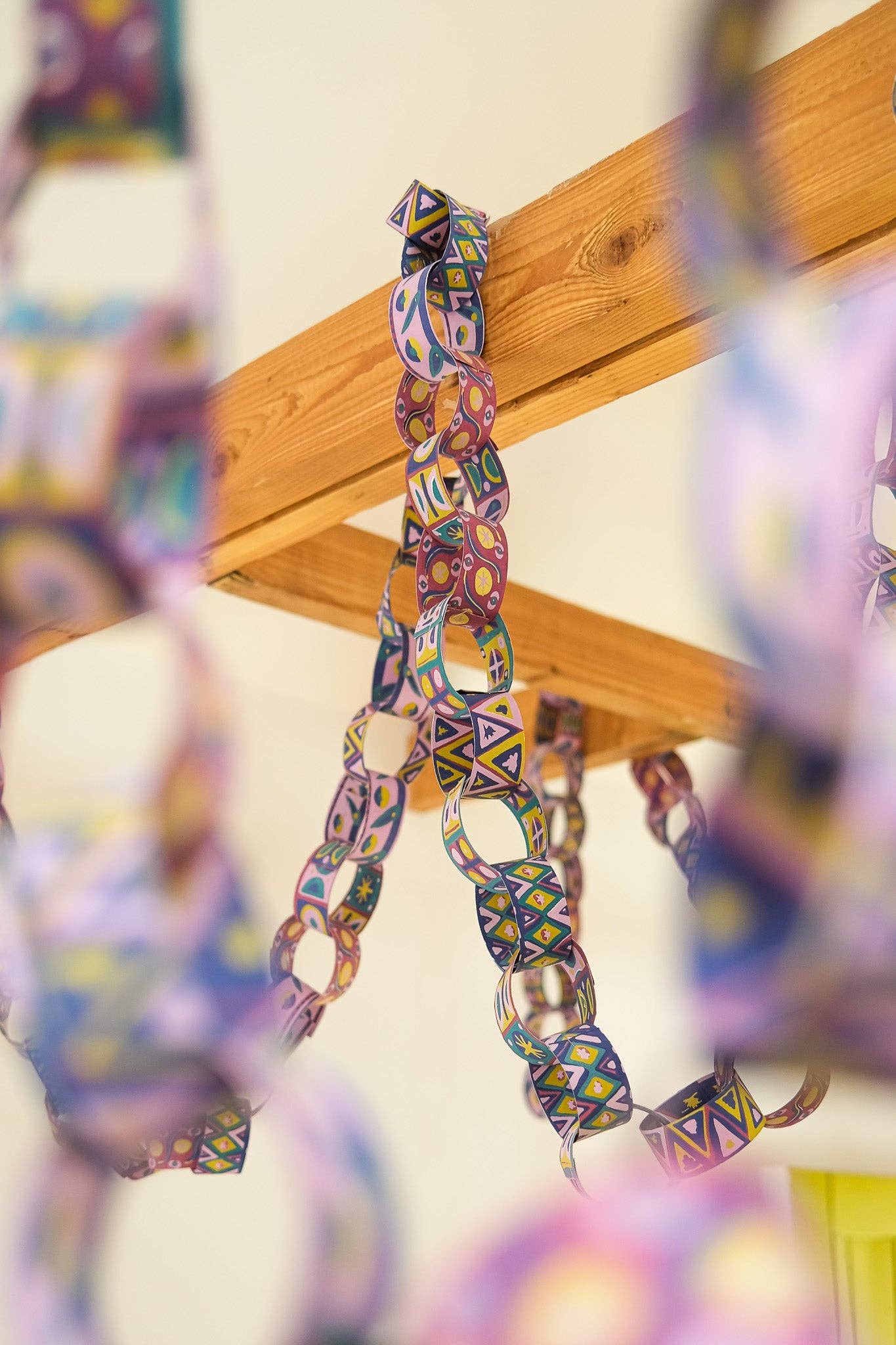 Assembled Bloomsbury paper chains hanging in a room