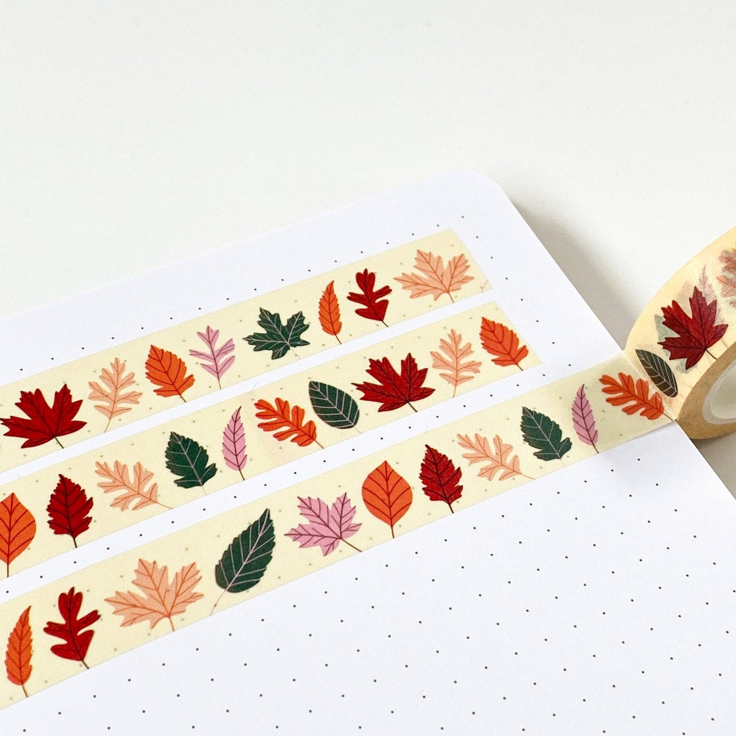 Autumn Leaves Washi Tape by Sarah Frances, colourful leaves on cream background, 15mm x 10m eco-friendly craft tape.