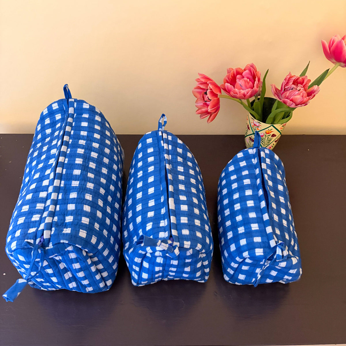 Small, medium and large cobalt check quilted cosmetic bags