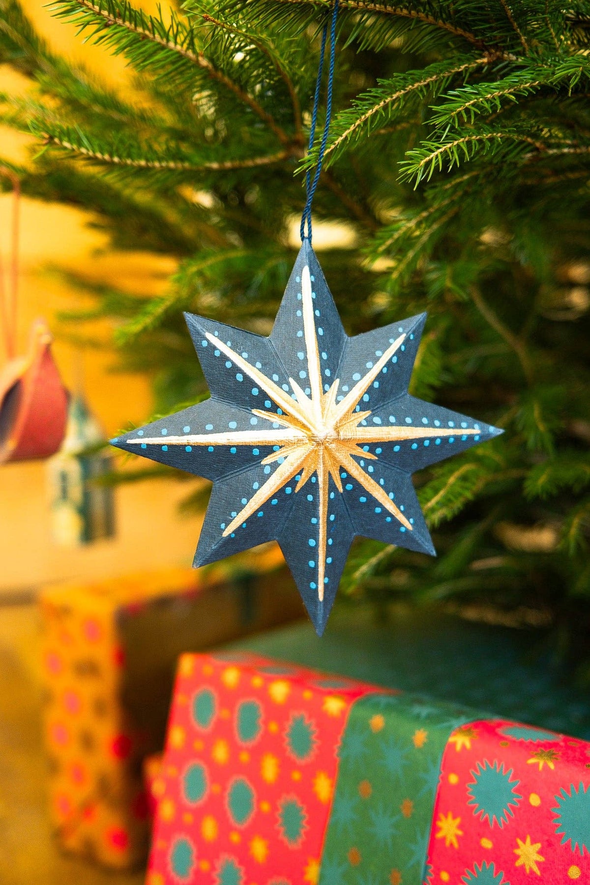 Sustainable recycled paper star hanging ornament