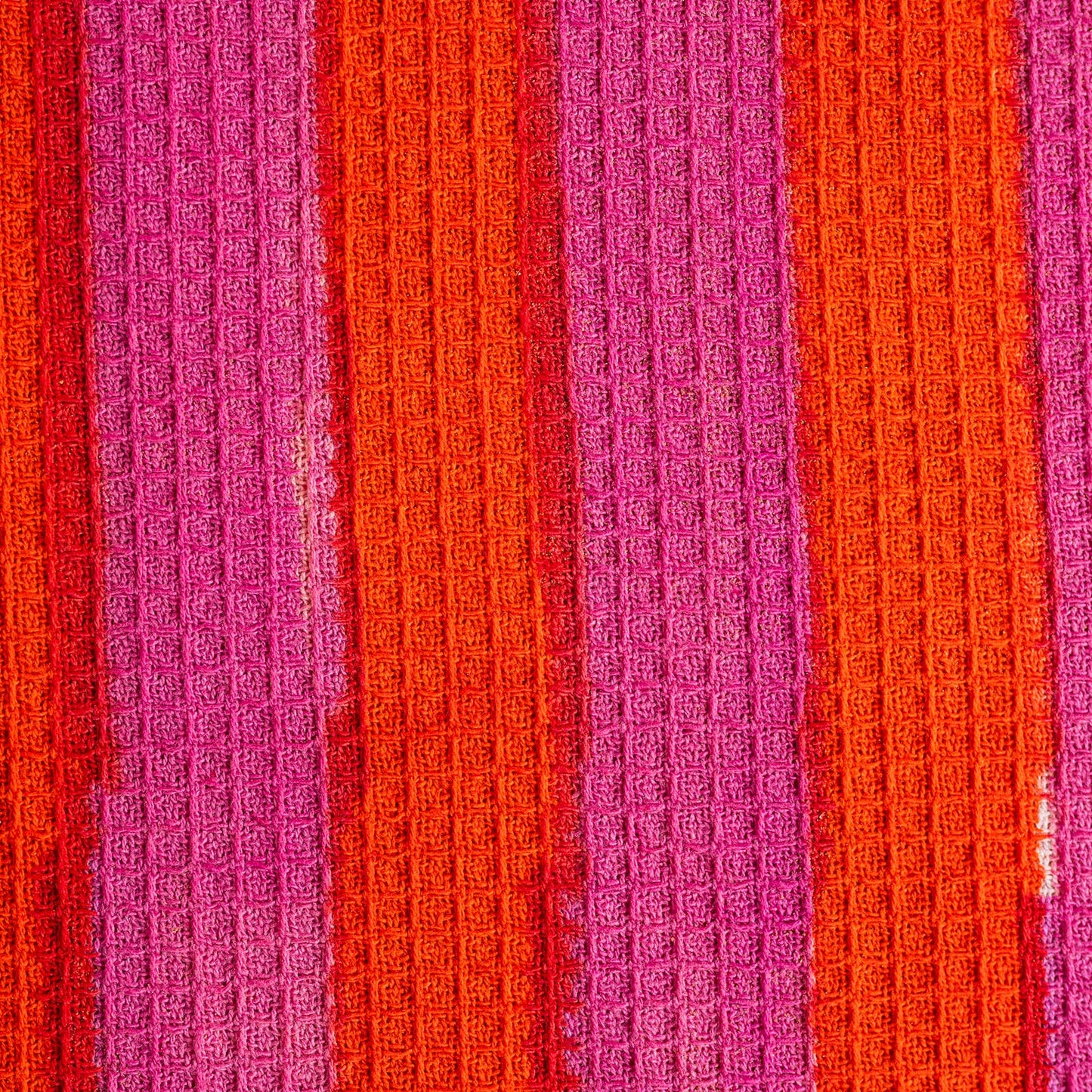 Close up of hand-block printed texture on terracotta tea towel