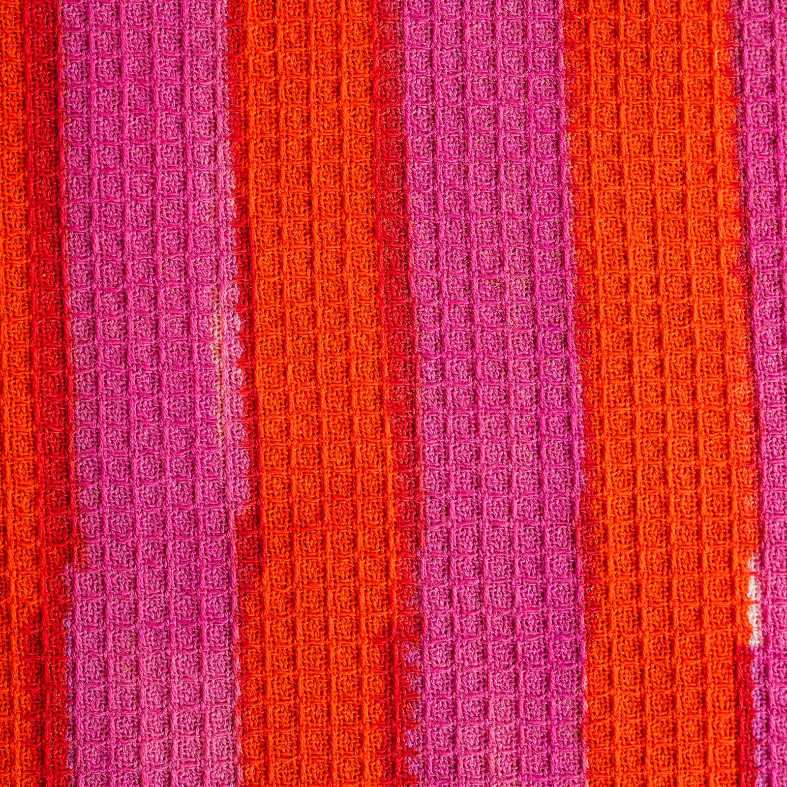 Close up of hand-block printed texture on terracotta tea towel