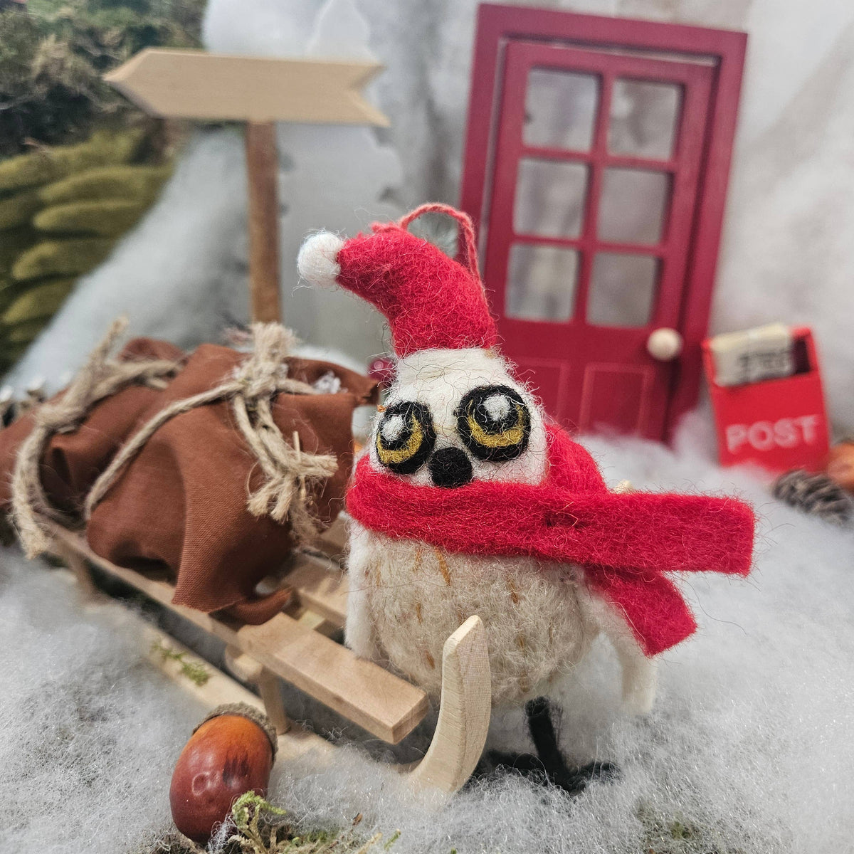 Back view of handmade felt snowy owl ornament with hanging loop