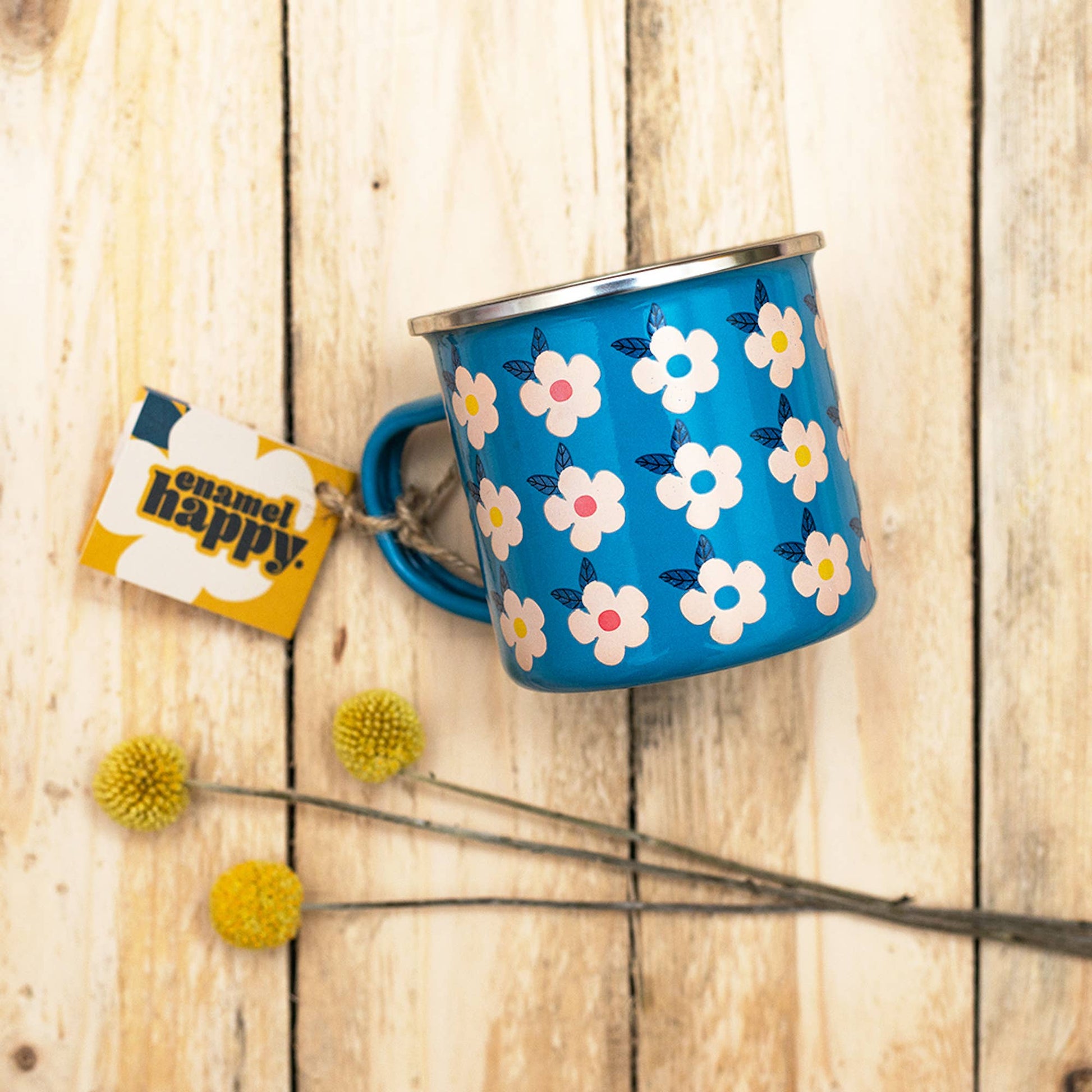 Close up of pink floral enamel mug handle